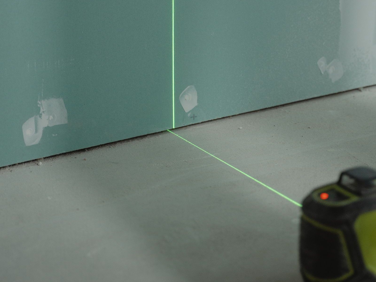 Levels set out with a laser before a dry screed board floor goes down